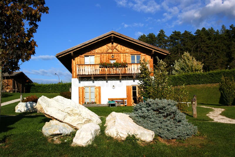 Chalet With Flowers and Wood