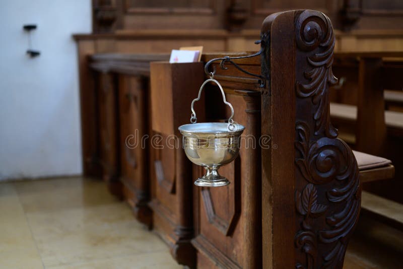 Chalice with holy water to the cross on entering a church royalty free stock photo Chalice with holy water to the cross on entering a church royalty free stock photo