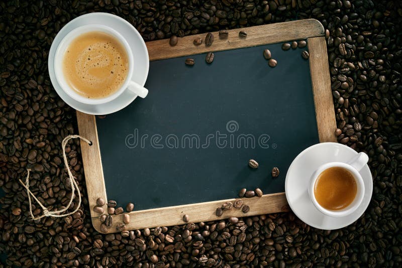 Chalk board or slate with cups of coffee and beans royalty free stock photos Chalk board or slate with cups of coffee and beans royalty free stock photos