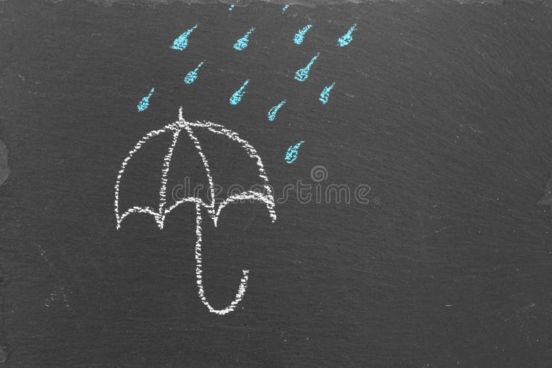 Chalk Drawing of an Umbrella and Rain Drops on Slate Stock Image