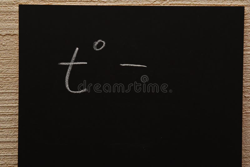 A chalk image on a blackboard of a single temperature sign that is used in medicine and meteorology royalty free stock photography
