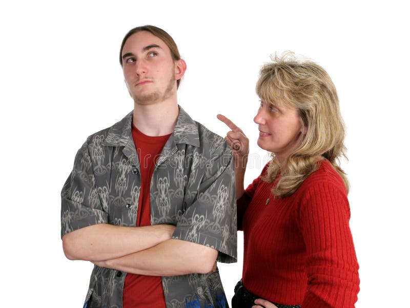 A teen boy ignoring his mother, rolling his eyes while she lectures him. A teen boy ignoring his mother, rolling his eyes while she lectures him.
