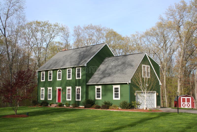 A large green country house. A large green country house.