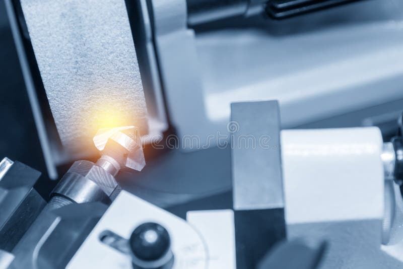 The chamfer tool sharpening at grinding machine royalty free stock image