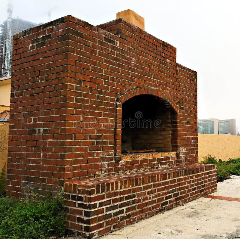 A well used outdoor brick fireplace. A well used outdoor brick fireplace