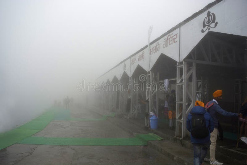 CHAMOLI DISTRICT, UTTARAKHAND, INDIA, June 2018, Tourist and visitors at Hemkund Sahib during Misty morning