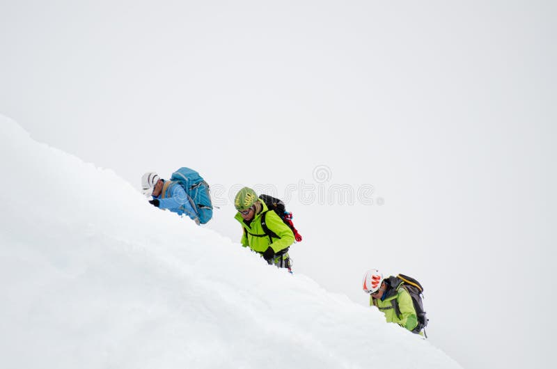 CHAMONIX, FRANCE - JUNE 8, 2013: Climbers in the French Alps mountains. Mont Blanc massif, Aiguille du Midi. Chamonix