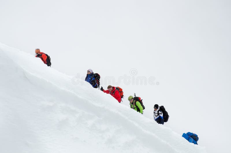 CHAMONIX, FRANCE - JUNE 8, 2013: Climbers in the French Alps mountains. Mont Blanc massif, Aiguille du Midi. Chamonix