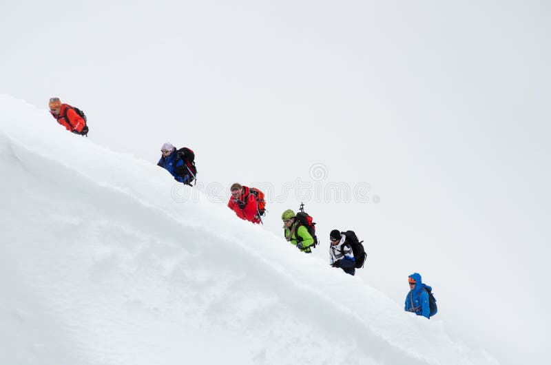 CHAMONIX, FRANCE - JUNE 8, 2013: Climbers in the French Alps mountains. Mont Blanc massif, Aiguille du Midi. Chamonix