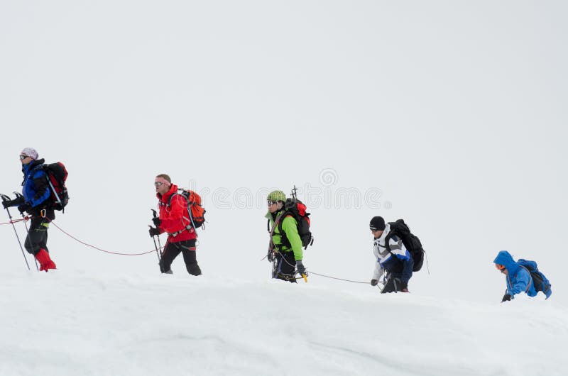 CHAMONIX, FRANCE - JUNE 8, 2013: Climbers in the French Alps mountains. Mont Blanc massif, Aiguille du Midi. Chamonix