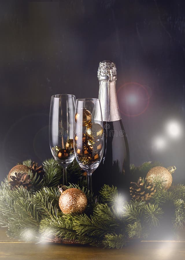 Champagne Bottle with Glasses with Decoration Wooden Background Christmas New Year Holidays Card New Year Background Vertical Toned.Snow. Champagne Bottle with Glasses with Decoration Wooden Background Christmas New Year Holidays Card New Year Background Vertical Toned.Snow.