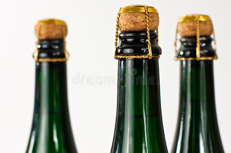 Row of champagne bottles stock photo. Image of foil, celebration 10911246