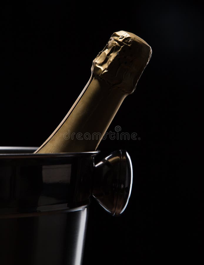 Champagne bucket on black background