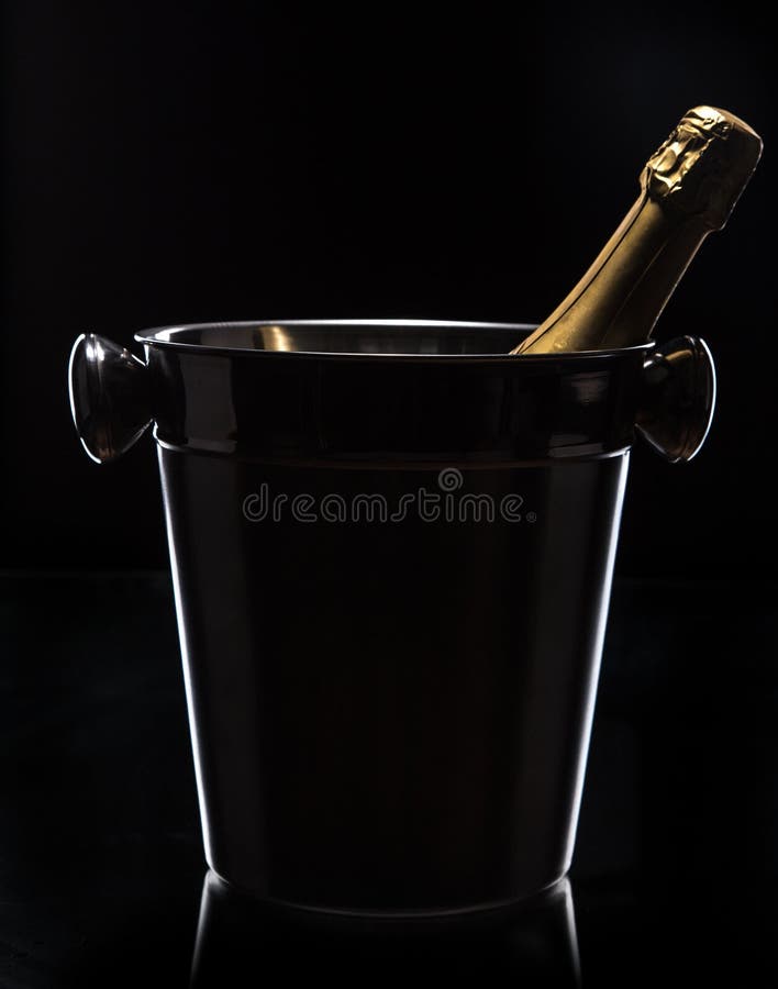 Champagne bucket on black background