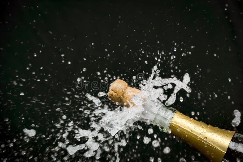 An image of a champagne cork popping out stock photography.