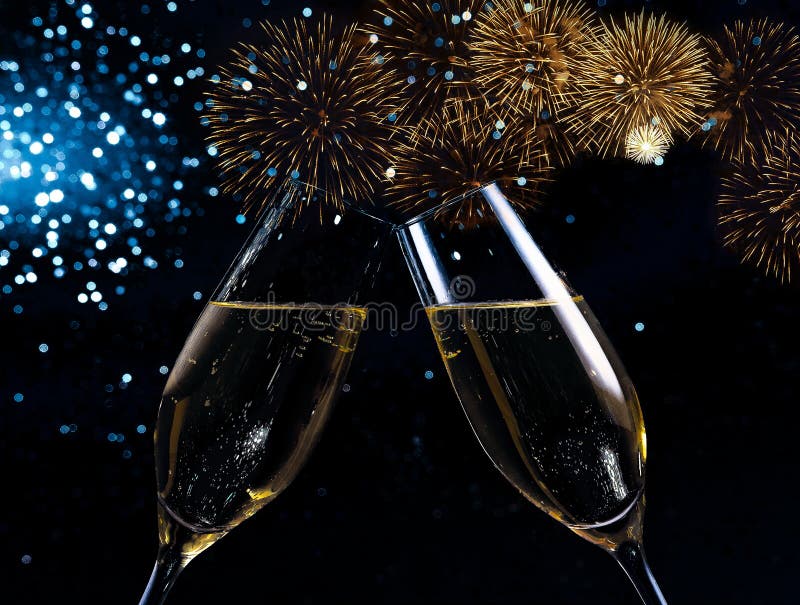 Champagne flutes with golden bubbles make cheers on blue light bokeh and fireworks sparkle background, happy new year concept. Champagne flutes with golden bubbles make cheers on blue light bokeh and fireworks sparkle background, happy new year concept