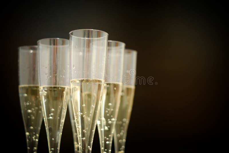 Champagne flutes glasses isolated on black. Champagne flutes glasses isolated on black