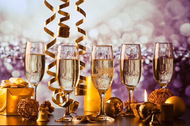 champagne glasses against holiday lights ready for New Year& x27;s eve party stock images champagne glasses against holiday lights ready for New Year& x27;s eve party stock images