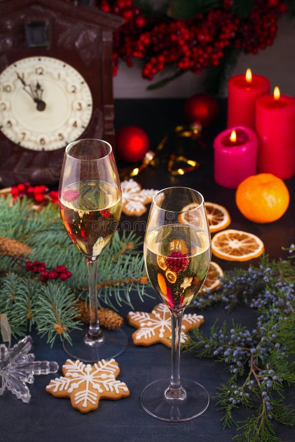 Champagne glasses in holiday setting. Christmas and New Year celebration with champagne