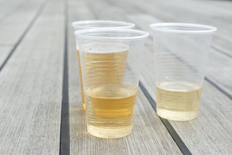Champagne in plastic cups stock image. Image of drink 66006607