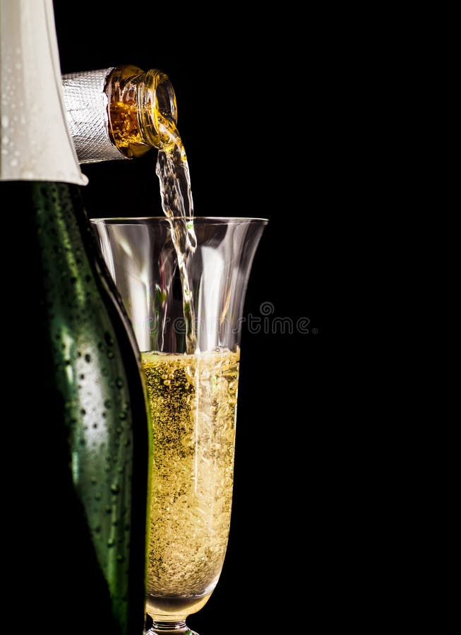 Champagne is poured into glass