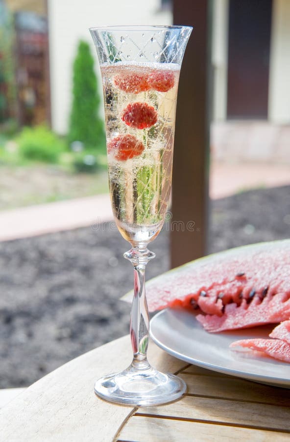 Champagne with raspberry