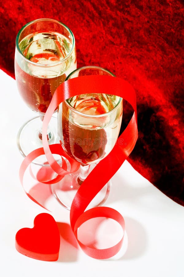 Champagne with red ribbon and heart