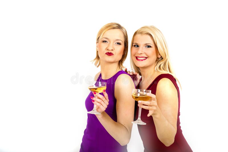 Duas belas mulheres de Natal a beber champanhe foto de stock royalty free