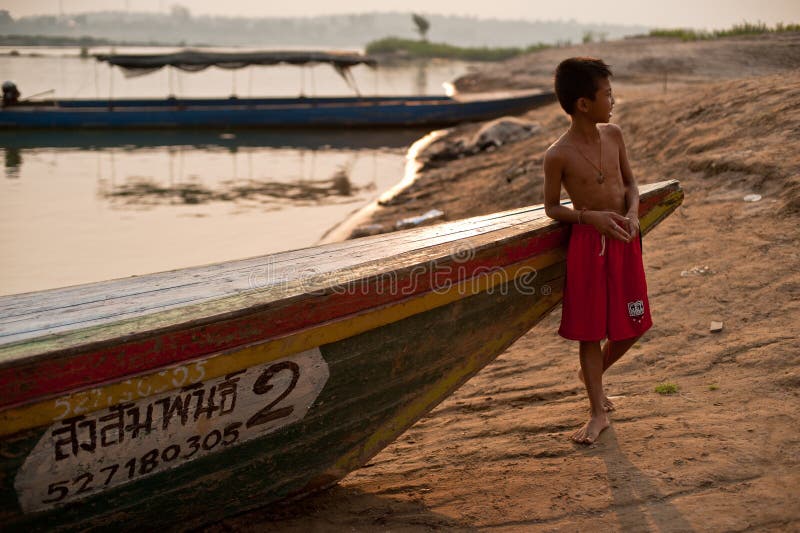 CHAMPASAK, LAOS - FEBRUARY 26 : Unidentified kid of Laos stand i