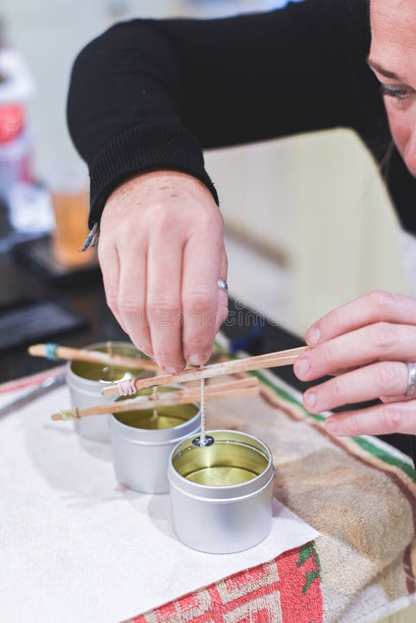 Candle Maker Shares Her Creation with an Eager Buyer, Surrounded by an ...