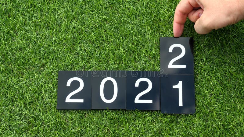2021-2022 change. Happy New Year 2022. Man hand changes the plates with numbers stock video