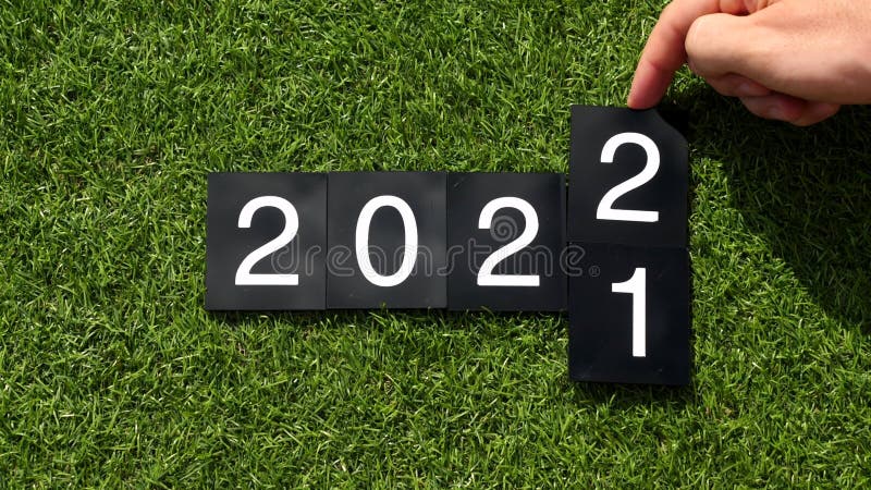 2021-2022 change. Happy New Year 2022. Man hand changes the plates with numbers stock video