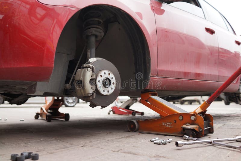 Jacking Up a Car To Change a Tyre Stock Image Image of changing