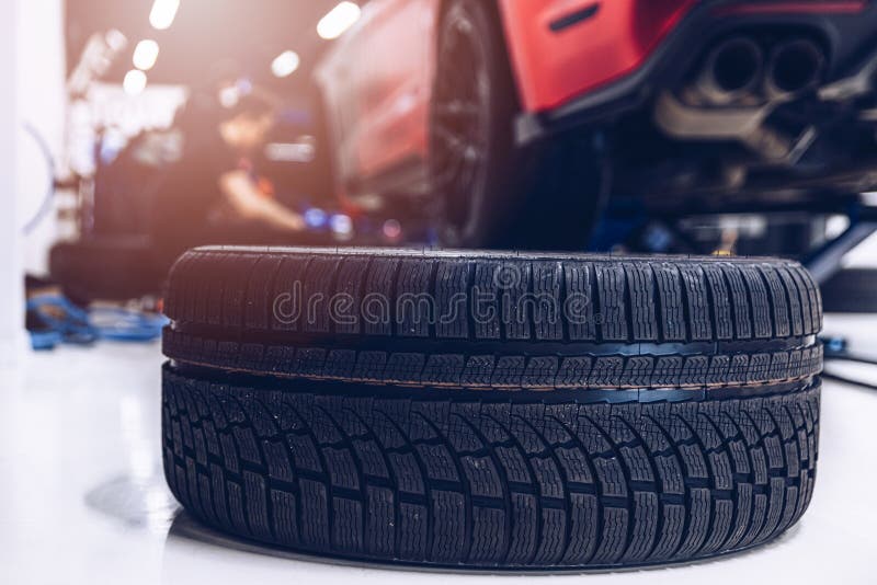 Changing Car Tire and Wheel in the Car Mechanical Service Stock Image