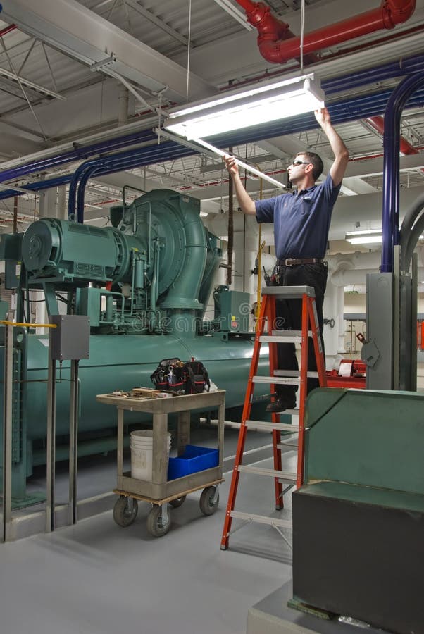 Changing fluorescent tube stock image. Image of factory 11037389