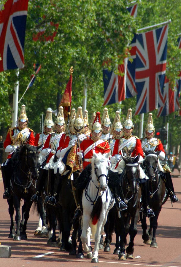 Changing of the guard, London. Soldiers arrive on horseback for the changing of the guard at Buckingham Palace in London Changing of the guard, London. Soldiers arrive on horseback for the changing of the guard at Buckingham Palace in London