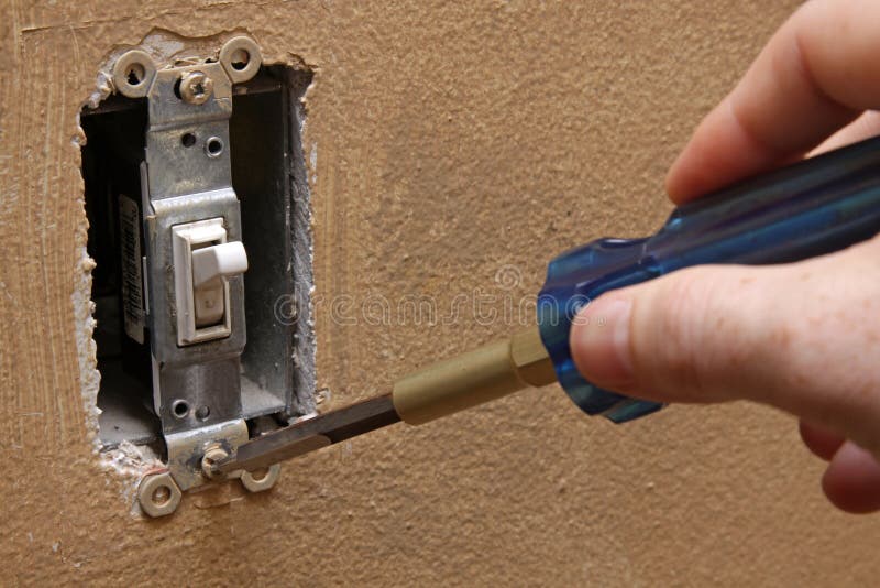 Changing a Light Switch stock image. Image of screwdriver 26861267