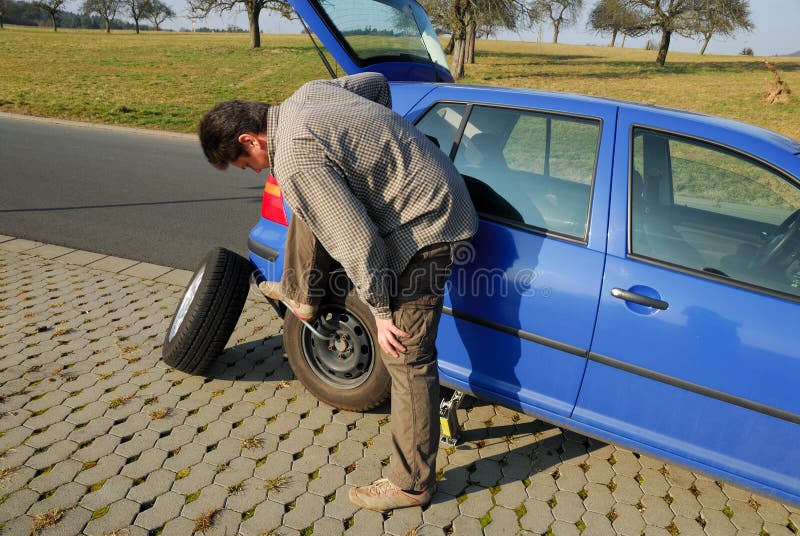 Changing a tire stock photo. Image of mechanic, unscrew 4420596