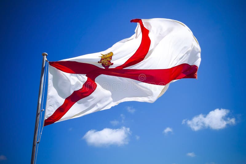 Channel Islands Jersey flag against blue sky