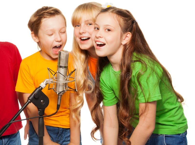 Boys and girls singing in microphone. Boys and girls singing in microphone