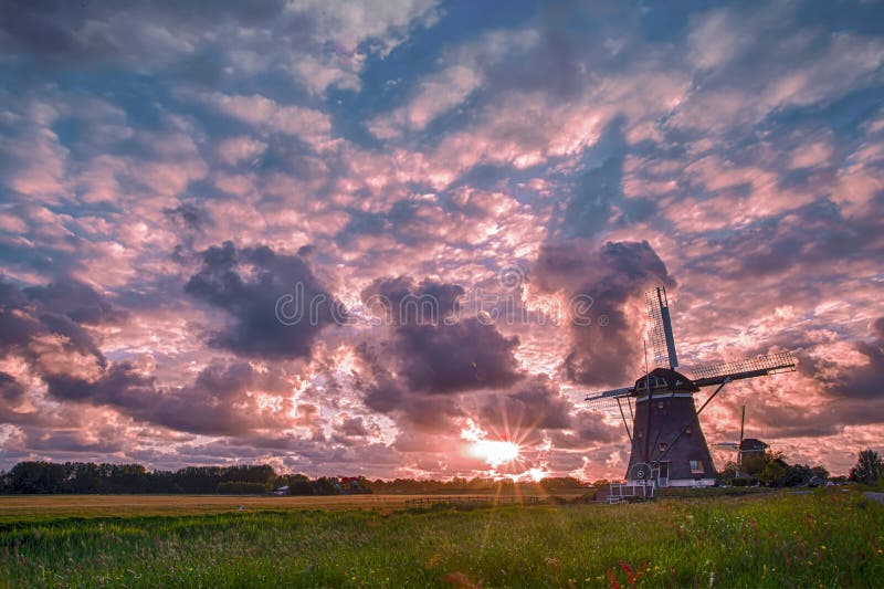 Chaotic windmills sunset with free place for message