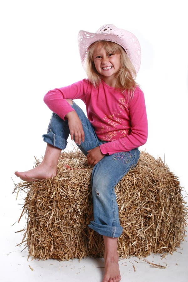 Chapeau de cowboy rose sur une fille photo stock Chapeau de cowboy rose sur une fille photo stock
