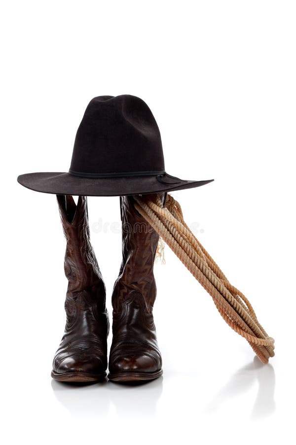 Chapeau, gaines et lasso de cowboy sur le blanc image libre de droits Chapeau, gaines et lasso de cowboy sur le blanc image libre de droits