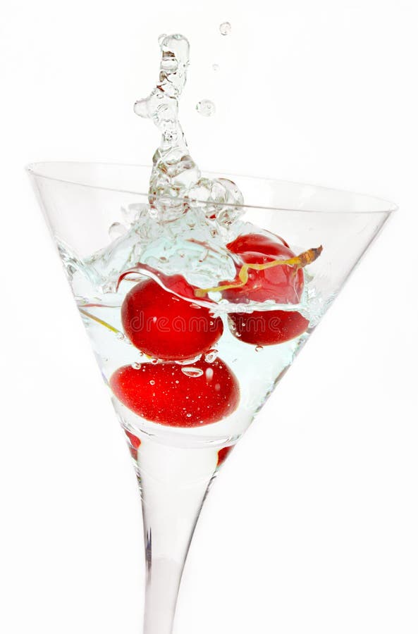 Chapoteo rojo del coctel de la cereza imagen de archivo libre de regalías Chapoteo rojo del coctel de la cereza imagen de archivo libre de regalías