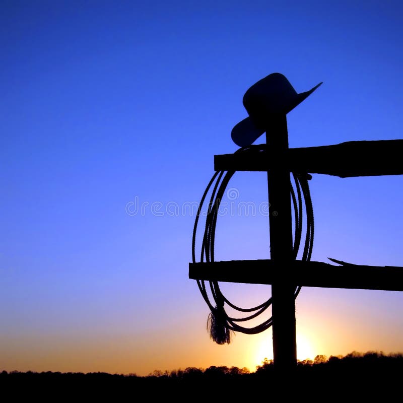 Chapéu de cowboy do rodeio e Lasso ocidentais americanos na cerca