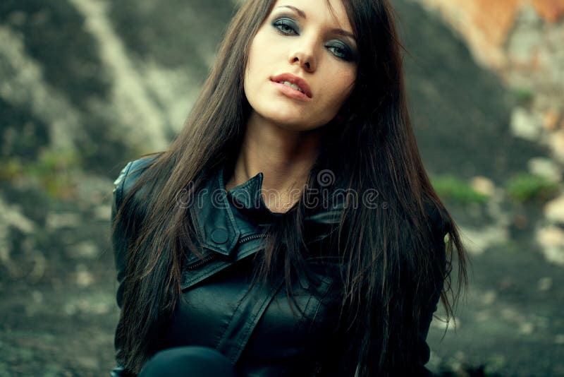 Closeup woman portrait wearing black leather jacket. Closeup woman portrait wearing black leather jacket
