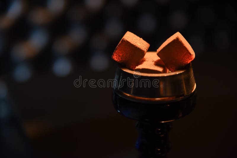 Hookah hot coals for smoking and leisure in natural lighting. Hookah hot coals for smoking and leisure in natural lighting