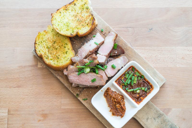 Charcoalboiled Pork Neck with Garlic Bread Stock Photo Image of garlic, roast 96445584