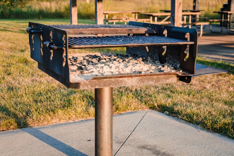 A Charcoal Grill at a Local City Park Ready for the Next Group Stock