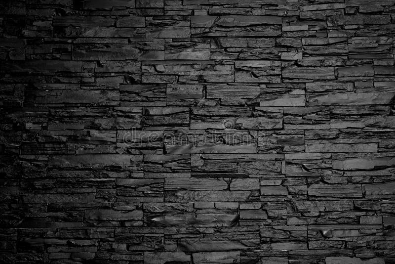 Charcoal stone wall background texture black and white